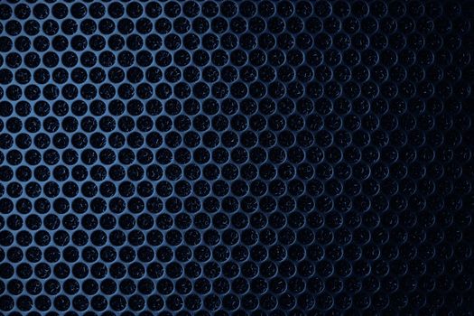 Safety net on the music speaker. Protective grid audio speakers. Close view of Black safety net. Metal perforated mesh, abstract pattern, Abstract black background. Professional audio equipment.