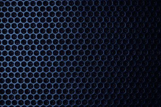 Safety net on the music speaker. Protective grid audio speakers. Close view of Black safety net. Metal perforated mesh, abstract pattern, Abstract black background. Professional audio equipment.