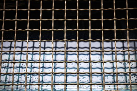 Protective grille on the windshield of an armored car. Police armored car with glass protection. MRAP Armored Transport Vehicle.