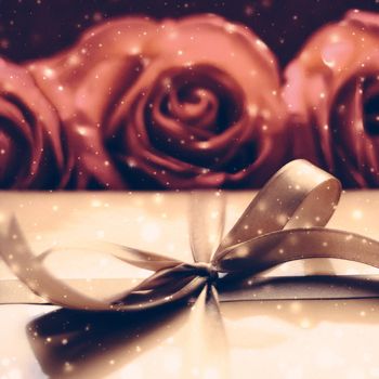 Vintage design, shop sale promotion and happy surprise concept - Luxury holiday golden gift box and bouquet of roses as Christmas, Valentines Day or birthday present