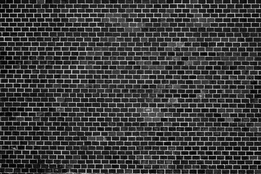 Old Black Brick Wall. An ancient fortress. Medieval brick building. Big Brick wall background texture.