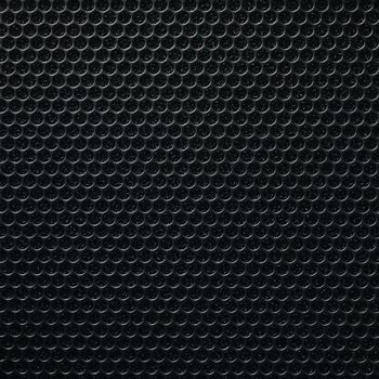 Safety net on the music speaker. Protective grid audio speakers. Close view of Black safety net. Metal perforated mesh, abstract pattern, Abstract black background. Professional audio equipment.
