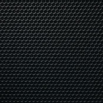 Safety net on the music speaker. Protective grid audio speakers. Close view of Black safety net. Metal perforated mesh, abstract pattern, Abstract black background. Professional audio equipment.