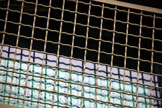 Protective grille on the windshield of an armored car. Police armored car with glass protection. MRAP Armored Transport Vehicle.
