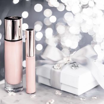 Cosmetic branding, Christmas glitter and girly blog concept - Holiday make-up foundation base, concealer and white gift box, luxury cosmetics present and blank label products for beauty brand design