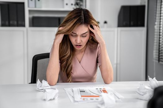 A competent female employee who has become completely exhausted as a result of overburdened work. Concept of unhealthy life as an office worker, office syndrome.
