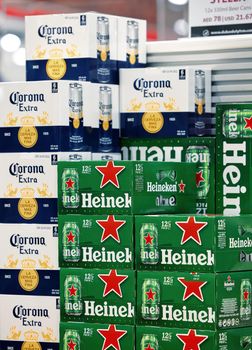 Heineken and Corona beer in boxes in a shelf in duty free shop in Dubai Airport. Popular beer in boxes. pack of Corona Extra Beer Cans. 12,02,2022, Dubai, UAE.