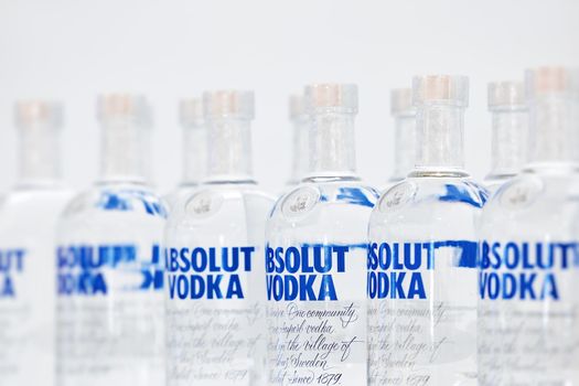 Bottles of Swedish vodka Absolut. Bottles of Absolut Vodka on a shelf of a duty free shop in Dubai Airport. 12,02,2022, Dubai, UAE.
