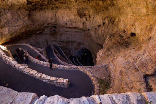 Switchback footpath winds into natural opening of Carlsbad Caverns.