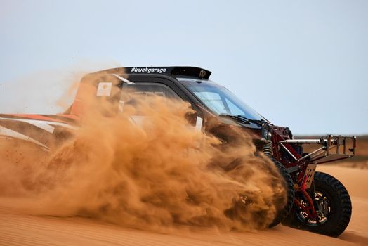 Sports car gets over the difficult part of the route during the Rally raid THE GOLD OF KAGAN-2021. 26.04.2021 Astrakhan, Russia.