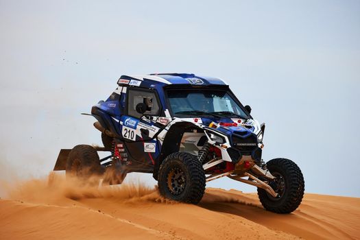 Women's crew at the rally. Sports car gets over the difficult part of the route during the Rally raid THE GOLD OF KAGAN-2021. 26.04.2021 Astrakhan, Russia.