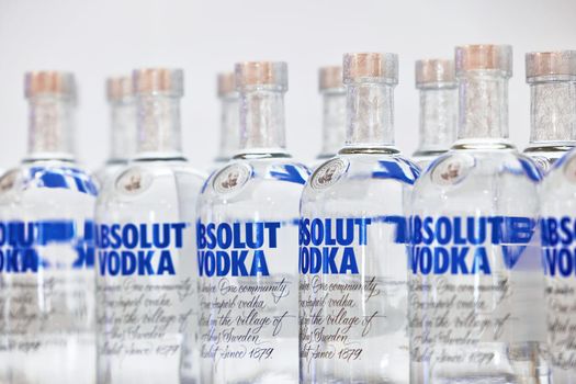 Bottles of Swedish vodka Absolut. Bottles of Absolut Vodka on a shelf of a duty free shop in Dubai Airport. 12,02,2022, Dubai, UAE.