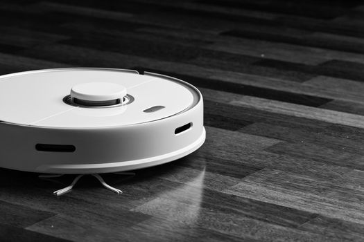 Smart Robot Vacuum Cleaner Xiaomi roborock s5 max on wood floor. Robot vacuum cleaner performs automatic cleaning of the apartment. 04.12.2020, Rostov region, Russia.