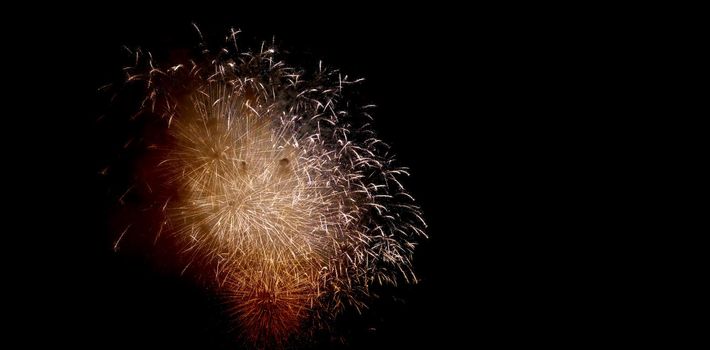 Colorful fireworks of various colors over night sky, Real Fireworks on Deep Black Background Sky on Fireworks festival show before independence day on 4 of July. Beautiful fireworks show.