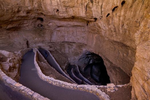 Switchback footpath winds into natural opening of Carlsbad Caverns.