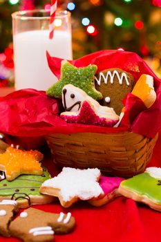 Assorted christmas cookies on red background.