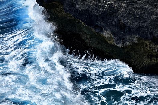 Rough sea close up. Beautiful blue waves with a lot of sea foam scene looked from above, close up. foam on the blue sea. Beauty world.