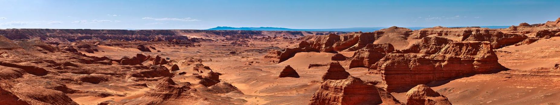 Herman Cav Canyon at sunset. South Gobi, Mongolia. Herman Tsav Canyon. Red Sandstone plateau, Martian landscape. The site of many paleontological finds. Cemetery of dinosaurs.