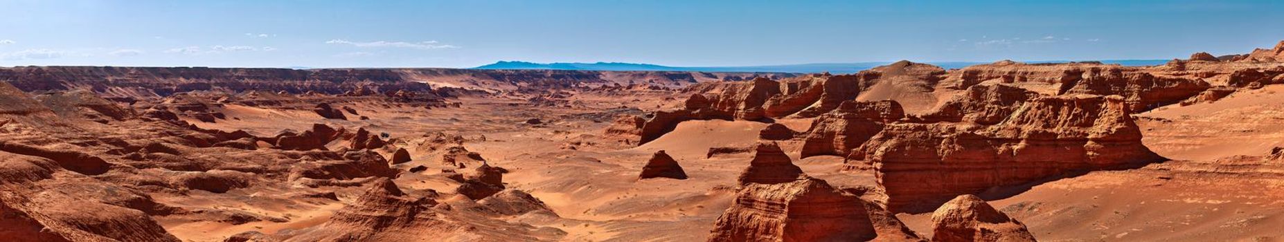 Herman Cav Canyon at sunset. South Gobi, Mongolia. Herman Tsav Canyon. Red Sandstone plateau, Martian landscape. The site of many paleontological finds. Cemetery of dinosaurs.