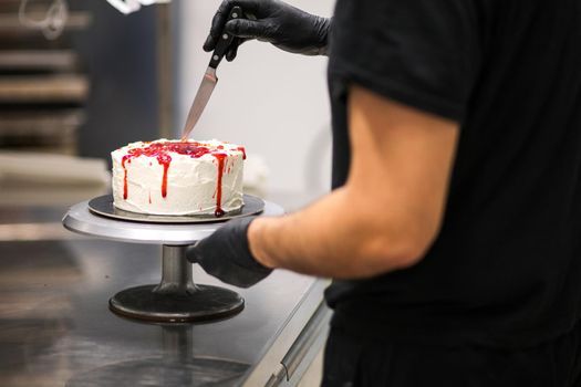 Bleeding monster cake with knife on cake stand