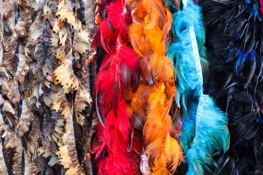 Detailed close up view on samples of cloth and fabrics in different colors found at a fabrics market.