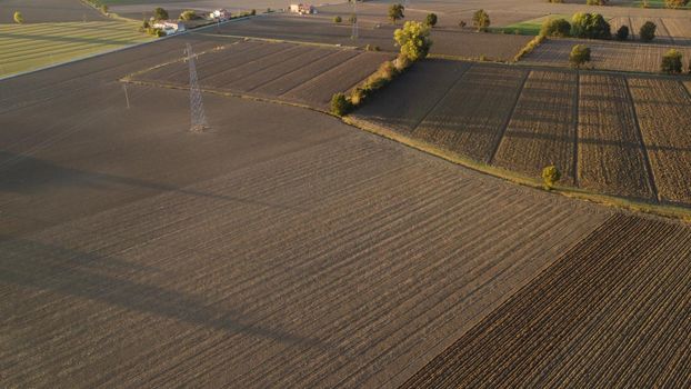 farmer with tractor leveling land in the countryside.