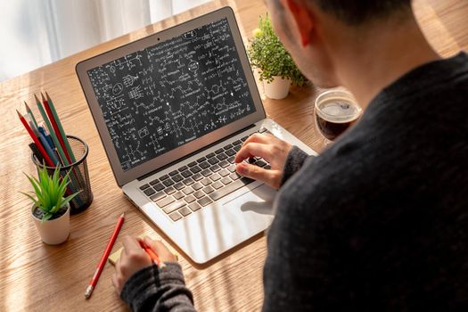 Mathematic equations and modish formula on computer screen showing concept of science and education