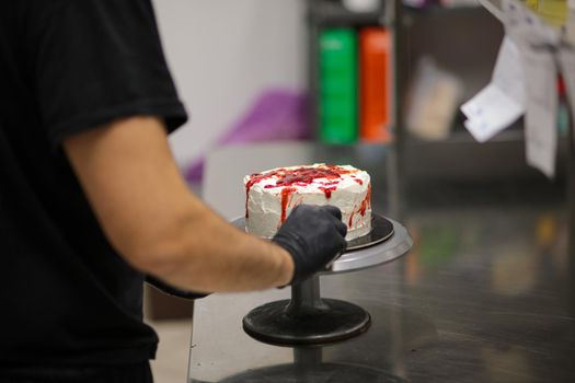 Bleeding monster cake with knife on cake stand