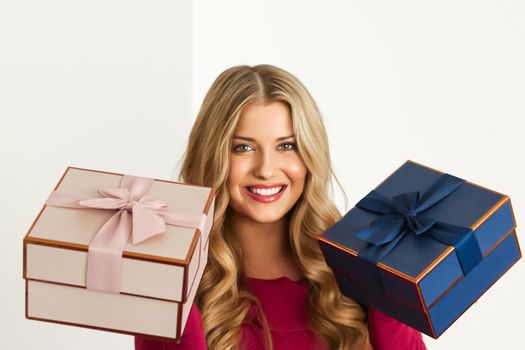 Happy woman holding gifts for birthday, anniversary, wedding, Valentines day or Christmas, luxury holiday present or beauty box subscription delivery concept