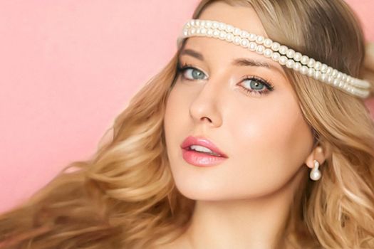 Beauty, pearl jewellery and hairstyle, beautiful blonde woman with pearls tiara on pink background as bridal make-up look, fashion and glamour model face portrait for cosmetics, skincare and hair care brand