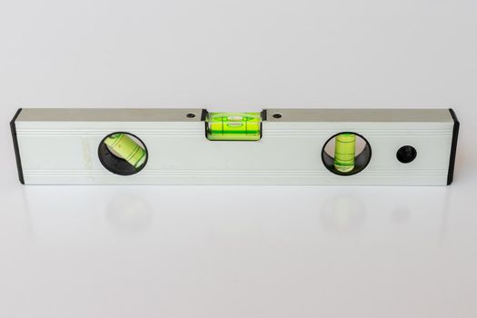 spirit level tool for leveling on isolated white background