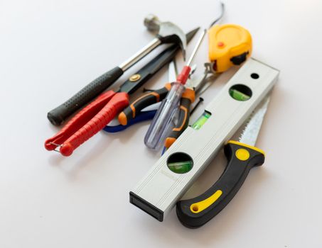 Equipments and hand tools set on a white isolated background with selective focus