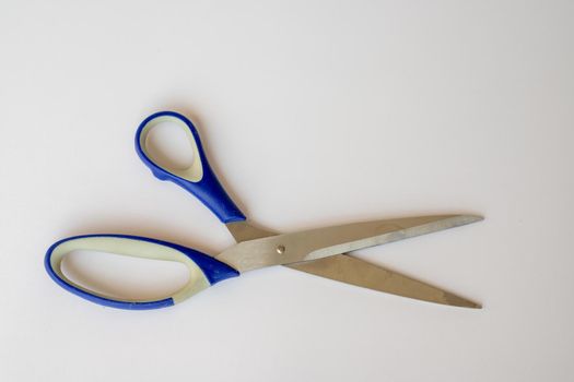 Scissors on white isolated background closeup view