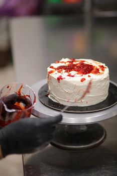 Bleeding monster cake with knife on cake stand