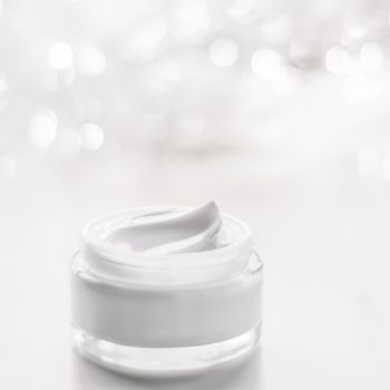 Cosmetic branding, gift and spa concept - Facial cream moisturizer jar on holiday glitter background, moisturizing skin care as lifting emulsion, anti-age cosmetics for luxury beauty skincare brand