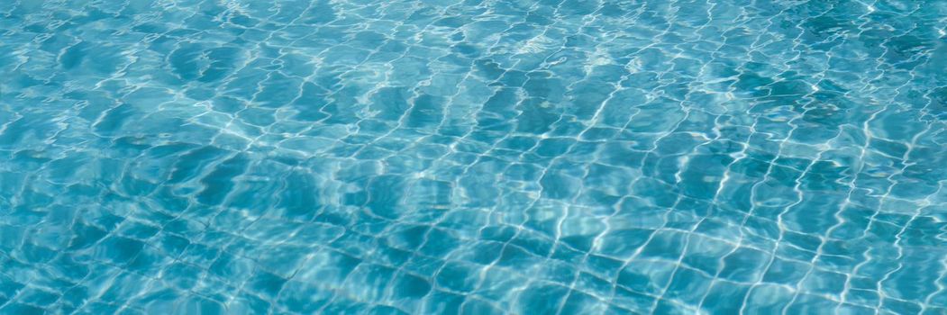 Abstract background Patterns Ripped water Surface swimming pool Light Reflection Vibrant blue green.