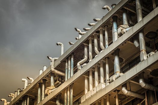 Air duct, air conditioner pipe on white ceiling wall. Ventilation system on the ceiling of large building