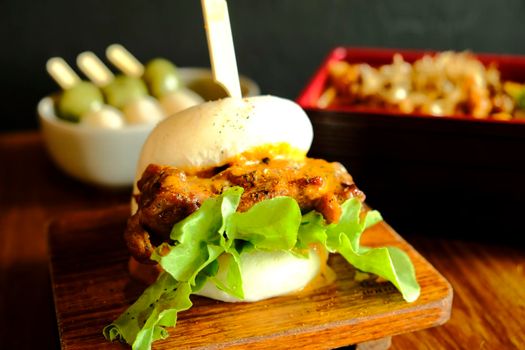 Hirata buns.  Japanese steamed buns filled with pork chashu, tempura, karaage. Japanese traditional food
