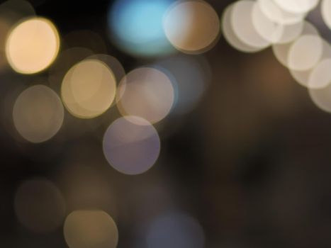Colorful blur bokeh background, lighting lamp at night in city.