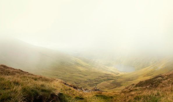 Amazing view in the national park Lake District in England on a foggy day in Autumn