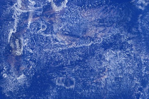 texture of frosty ice, hoarfrost on a blue background. water crystals