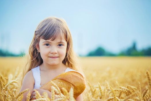 Child and bread. selective focus. food and drink.