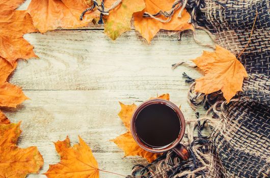 A cup of tea and a cozy autumn background. Selective focus. food.