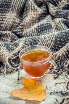 A cup of tea and a cozy autumn background. Selective focus. food.