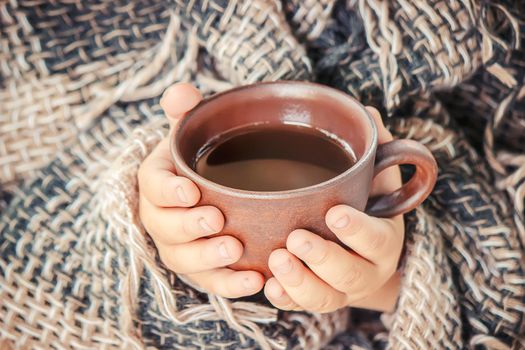 A cup of tea and a cozy autumn background. Selective focus. food.