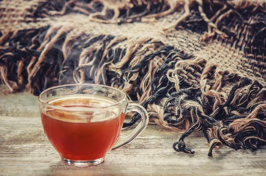 A cup of tea and a cozy autumn background. Selective focus. food.