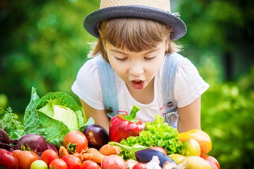 Child and vegetables on the farm. Selective focus. nature.