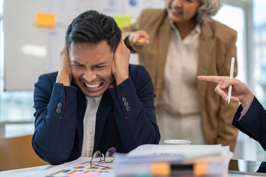 Stressed annoyed office employee having headache migraine at business finance meeting.