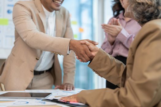 Business partnership meeting concept. Image businessmans handshake. Successful businessmen handshaking after good deal. Group support concept.