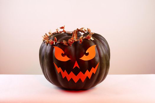 Halloween Pumpkin with Paper Cut Scary Face on a White Background. Jack Halloween. Smile Jack Pumpkin. Copy space